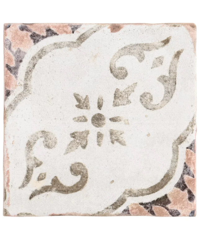 Decorative tile with intricate patterns on a white background