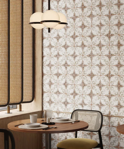 Dining area with patterned wall, round table, and chairs.