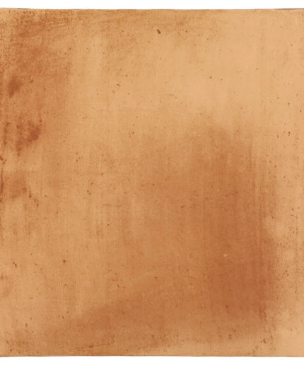 Peach-toned ceramic tile with a rustic, matte finish for floor or wall decor.