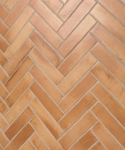 Peach terracotta tile with herringbone pattern for floors or walls