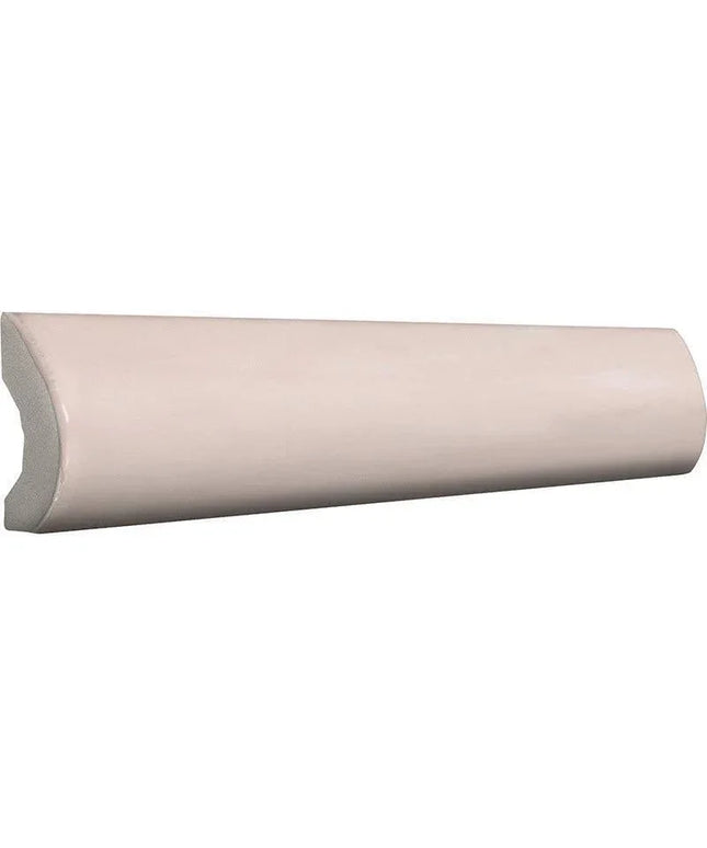 A curved, semi-glossy ceramic or porcelain tile trim piece in a light beige or warm off-white color, shown against a plain white background.