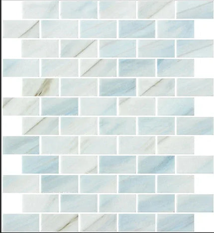 Mosaic pattern of light blue and white tiles