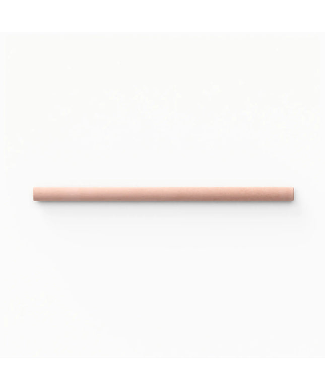 A single light peach-pink cylindrical stick or rod centered horizontally on a plain white background.