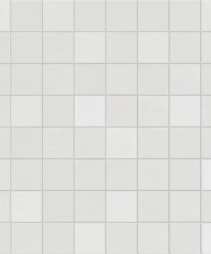 Pattern of small white tiles on a white background