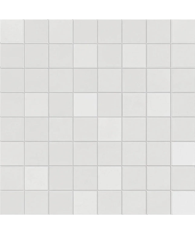 Pattern of small white tiles on a white background
