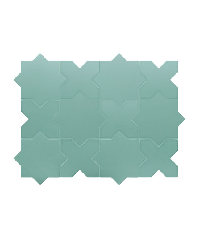 Teal ceramic tile with geometric pattern on a white background