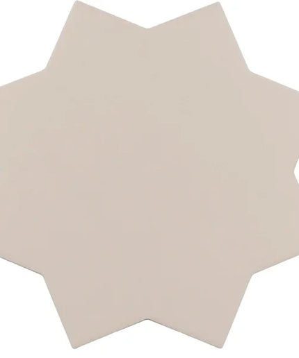 A single star-shaped ceramic tile in a light warm beige color, shown against a plain white background.