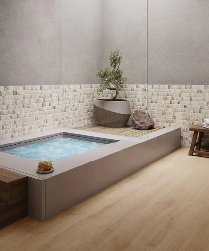 Modern indoor hot tub with mosaic tile wall and wooden floor