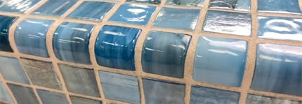 Blue glass mosaic tiles with quarter round trim for walls or pool edging