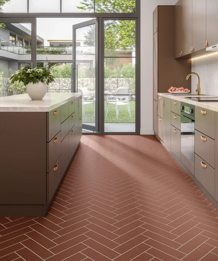 Modern kitchen with brown 3x11 subway tile flooring in herringbone pattern