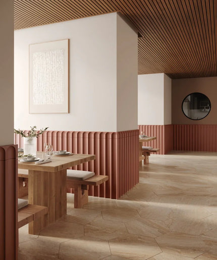 Cafe interior with brown fluted column wall tiles and wood furniture, hexagon floor tiles