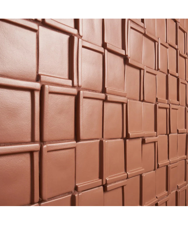 Close-up of a chocolate bar with square segments