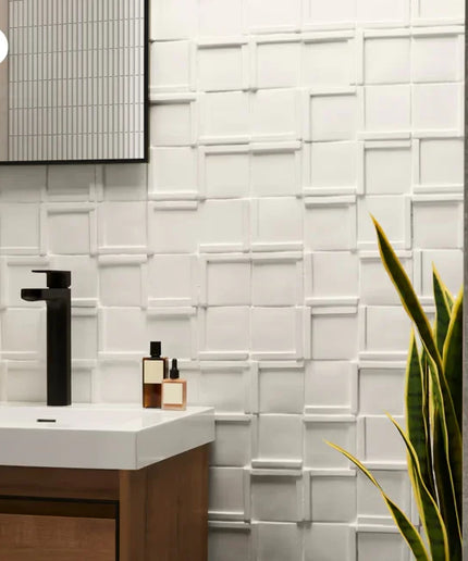 Bathroom with white tiled wall, sink, and decorative elements