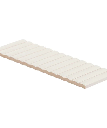 White wooden bench with a slatted design on a white background