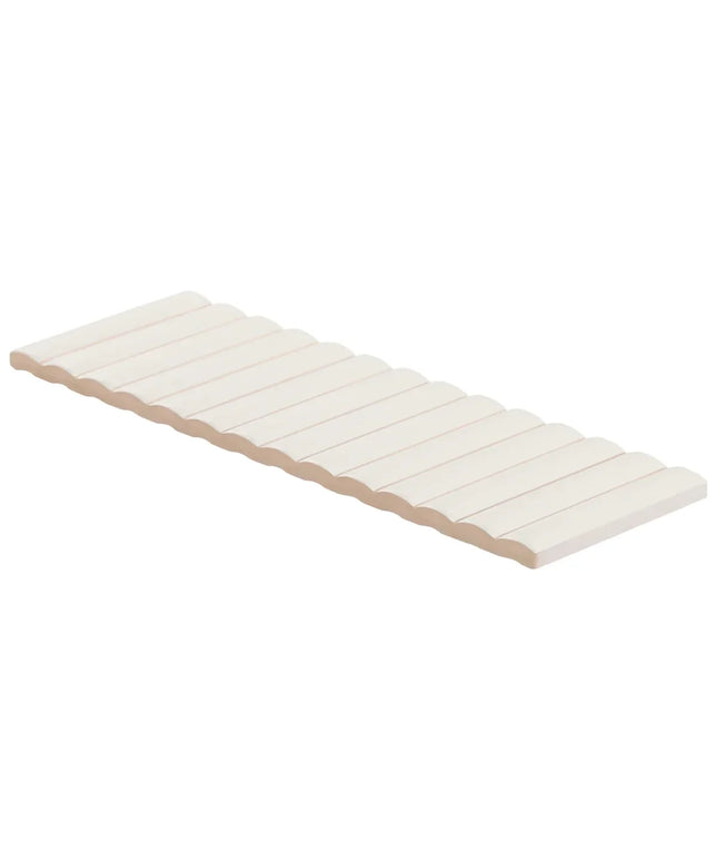 White wooden bench with a slatted design on a white background