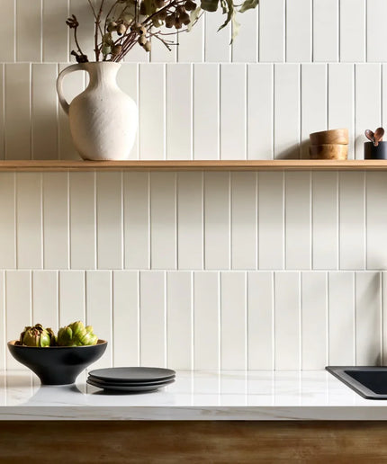 White vertical subway tiles backsplash in modern kitchen with open shelf
