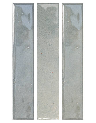 Three tall, narrow rectangular glass tiles in a vertical triptych layout, featuring a glossy finish with subtle gray and blue-green reflections on a white background.