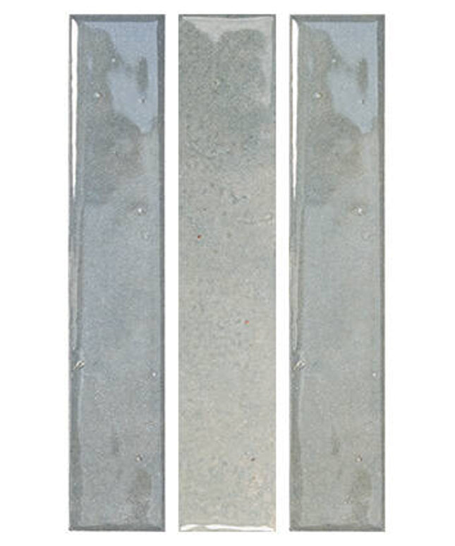 Three tall, narrow rectangular glass tiles in a vertical triptych layout, featuring a glossy finish with subtle gray and blue-green reflections on a white background.