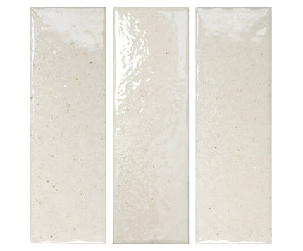 Three rectangular tiles with a speckled pattern on a white background