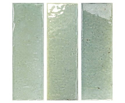 Three vertical rectangular ceramic tiles in a pale sage green glaze, displayed side-by-side against a plain white background.