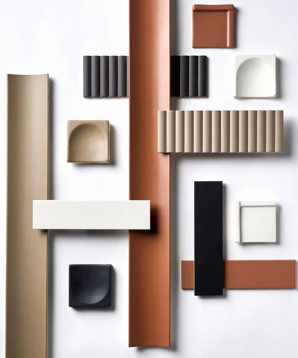 Assorted decorative wall and floor tiles in neutral and terracotta tones on a white background.