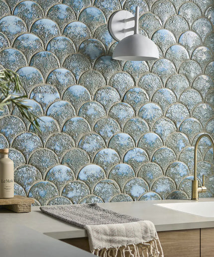 Kitchen with decorative tiled wall and modern fixtures
