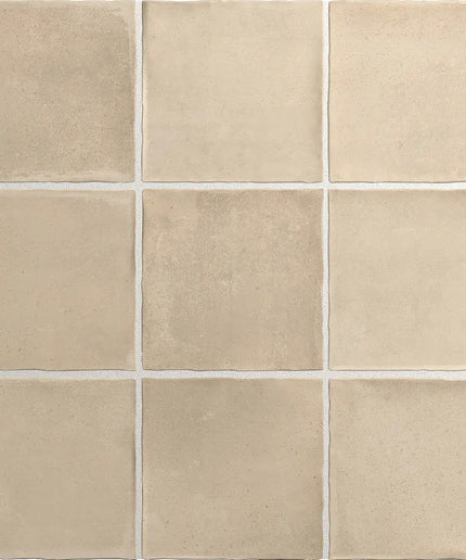 Beige square tiles arranged in a grid pattern