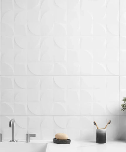 Bathroom with white tiled wall, sink, and decorative elements.