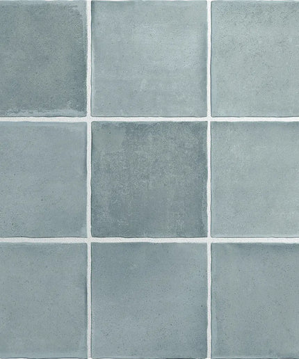 Grid of blue tiles with a textured surface