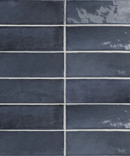 Glossy dark blue 2x6 subway tiles with subtle texture, ideal for kitchen backsplash or bathroom walls.