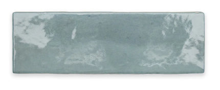 Glossy light blue rectangular ceramic wall tile with smooth, reflective finish