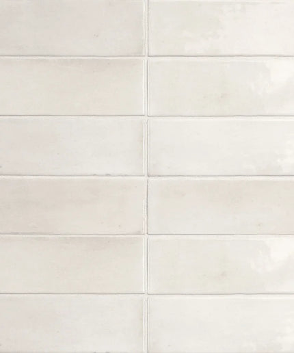 Glossy white 2x6 subway tiles with subtle texture, ideal for kitchen backsplash or bathroom walls