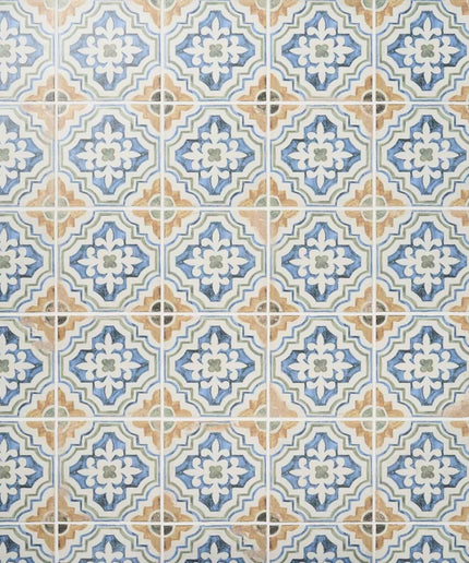 Decorative blue and tan patterned wall tiles, ideal for kitchen backsplash or bathroom decor.