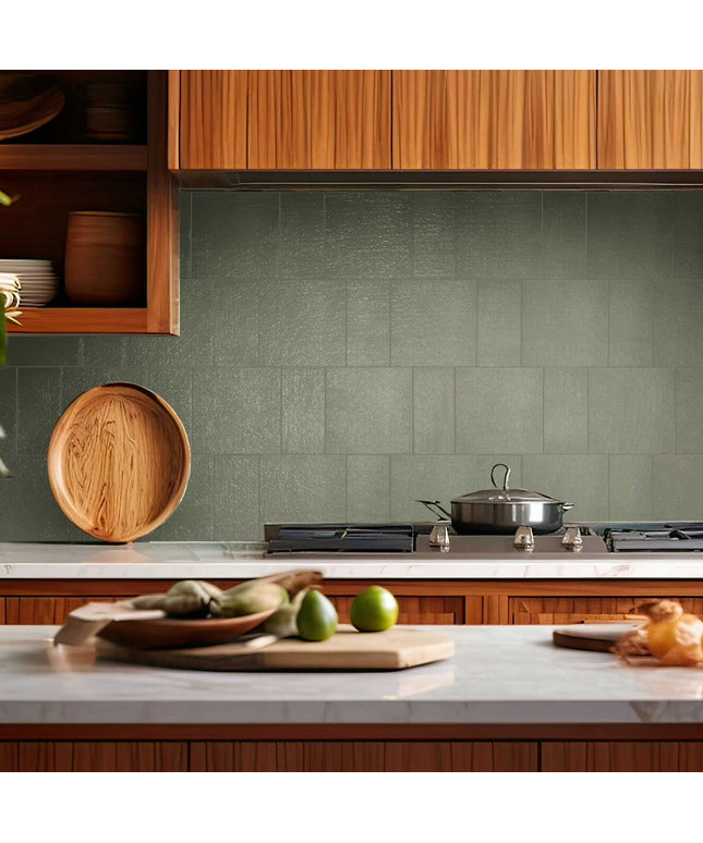 Sage mist 3x7 porcelain tile kitchen backsplash with stove and wood cabinetry