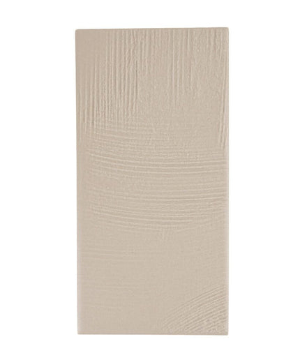 Rectangular beige porcelain tile with subtle sandstone texture, 3x7 inches