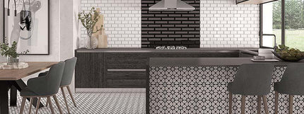 Modern kitchen with black and white decor, including a dining table and chairs.