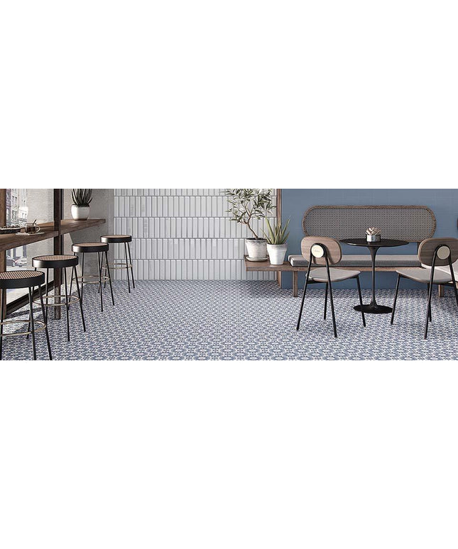 Modern cafe interior with tables, chairs, and decorative elements.