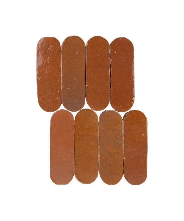 Sundried clay oval 2x6 tiles with glossy finish, arranged in a grid pattern on white background