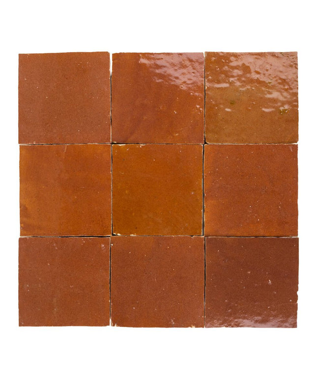 Sundried clay 4x4 zellige tiles with glossy handmade finish, perfect for backsplash or shower walls