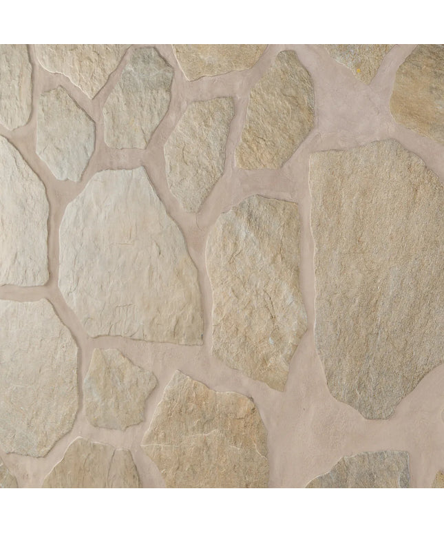 Close-up of a stone wall with beige and brown stones