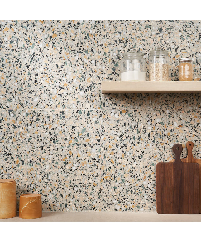 Terrazzo-style wall with a shelf and wooden cutting boards.