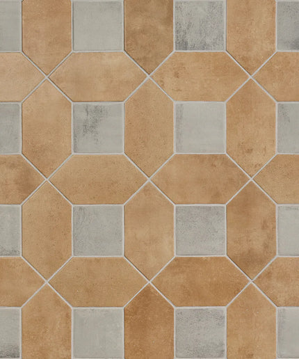 Hexagonal tiles with a mix of brown and gray colors on a tiled wall.