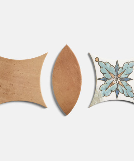Three decorative tiles with different patterns on a white background
