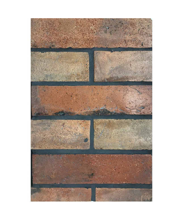 Terracotta brick-look tiles in a 3x12 subway pattern with a rustic finish