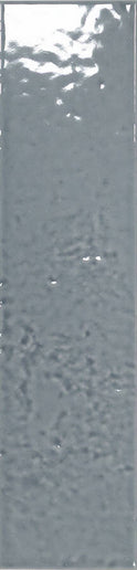 A close-up of a gray textured surface with a slightly reflective, mottled finish.