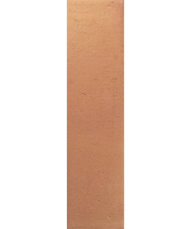 A close-up of a warm tan or light brown textured surface filling the frame.