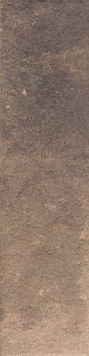 A square sample tile of textured brown material, showing a mottled earthy surface with variations in tone from dark brown to warm tan.