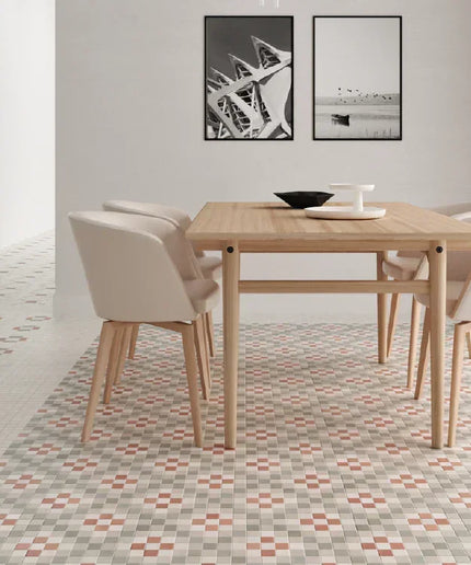 Dining area with a wooden table and chairs on a patterned floor.