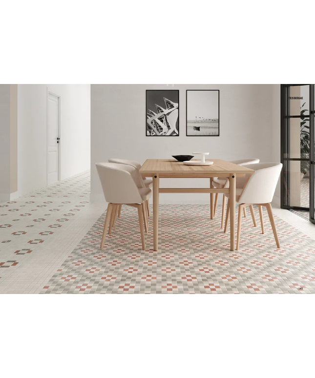 Dining area with a wooden table and chairs on a patterned floor.