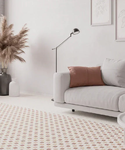 Modern living room with a gray sofa, wooden cabinet, and decorative elements.